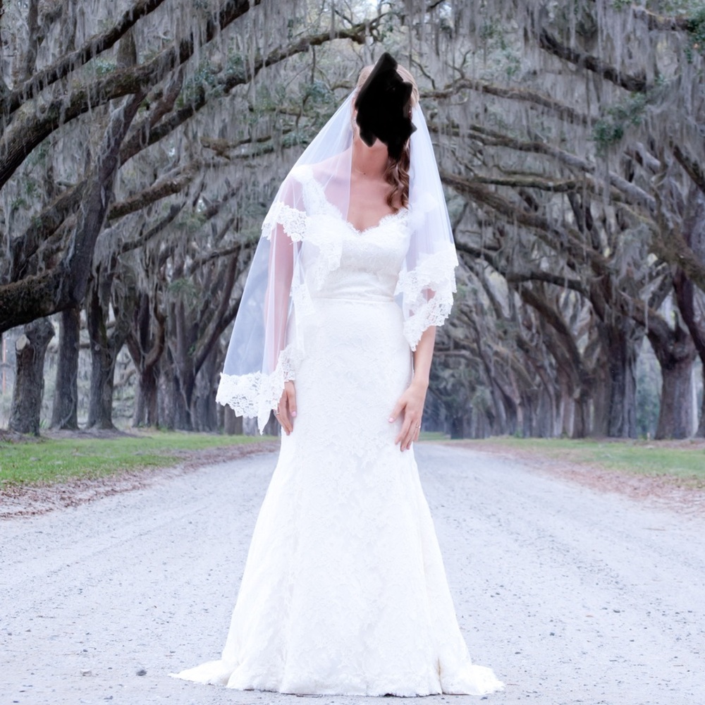 Beautiful ivory/cream Paloma Blanca lace wedding dress